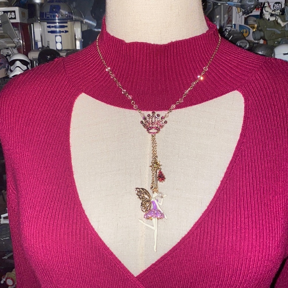 Betsey Johnson ballerina with butterfly wings and crown holding it necklace